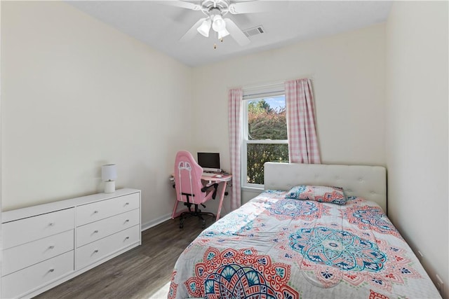 bedroom with ceiling fan and dark hardwood / wood-style floors