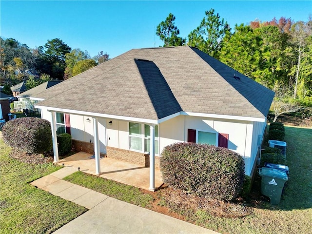 view of front of house with central AC and a patio