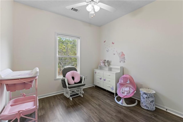 playroom featuring ceiling fan and dark hardwood / wood-style flooring