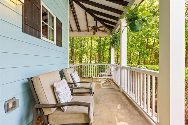 balcony featuring a porch and a ceiling fan