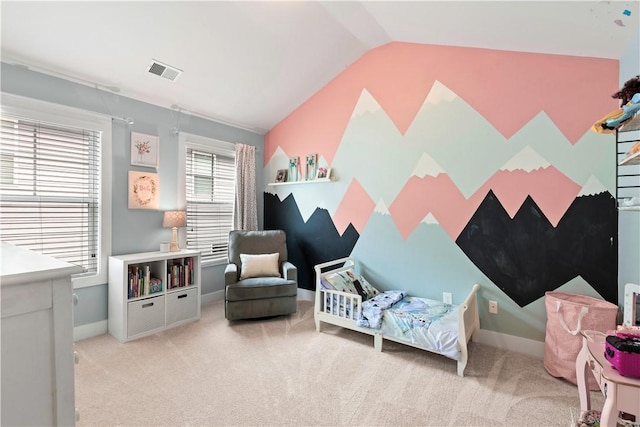 sitting room with baseboards, carpet, lofted ceiling, and visible vents