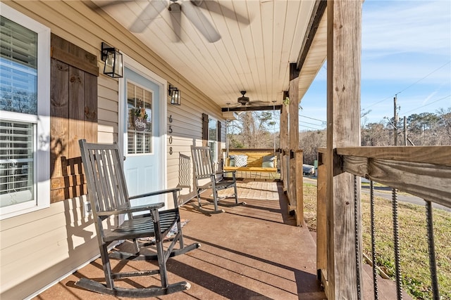 view of patio featuring ceiling fan and a porch