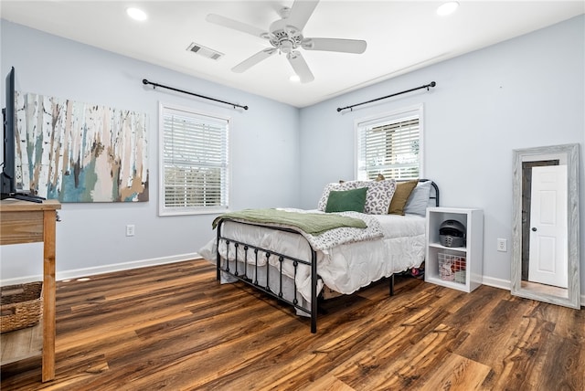 bedroom featuring recessed lighting, visible vents, a ceiling fan, wood finished floors, and baseboards