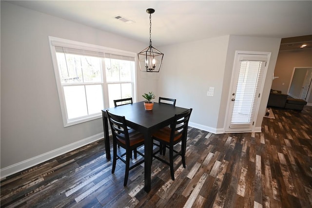 86 Lee Road 2229, Opelika, AL 36804 - dining area featuring dark wood-style floors, a chandelier, and baseboards