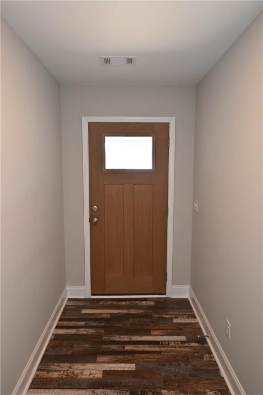 86 Lee Road 2229, Opelika, AL 36804 - doorway to outside featuring dark wood-style floors and baseboards