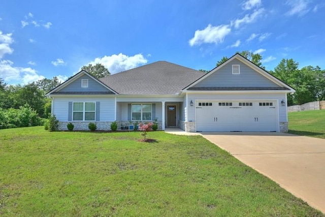 86 Lee Road 2229, Opelika, AL 36804 - craftsman-style home with an attached garage, driveway, a front yard, a shingled roof, and stone siding