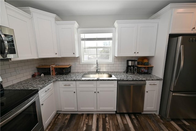 86 Lee Road 2229, Opelika, AL 36804 - kitchen with appliances with stainless steel finishes, a sink, white cabinets, and tasteful backsplash