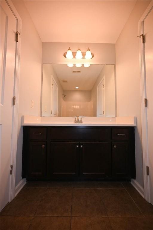 bathroom with tile patterned floors and vanity