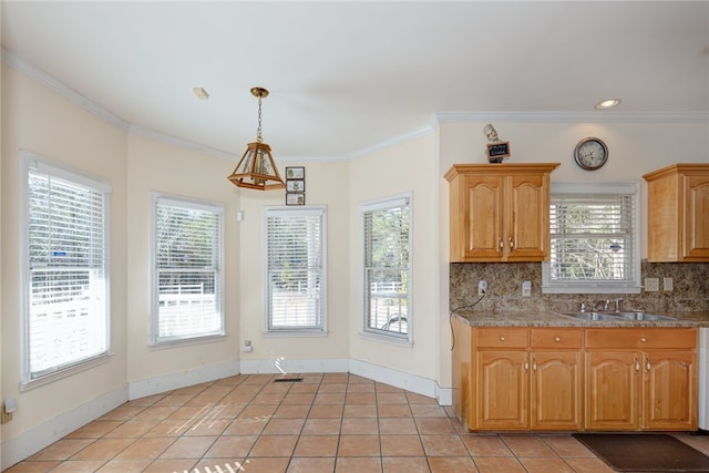 kitchen with crown molding, light tile patterned floors, sink, and backsplash