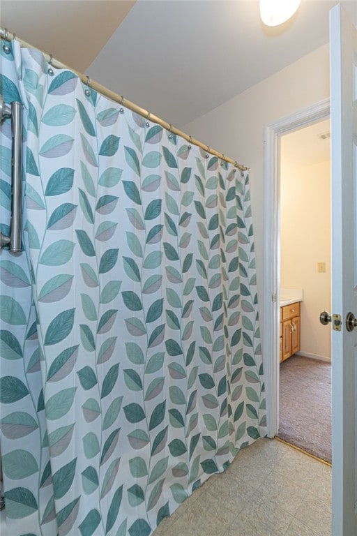 bathroom with vanity and a shower with curtain