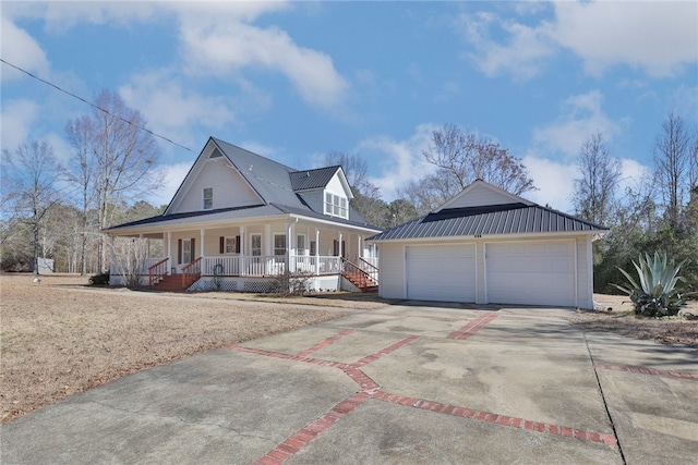 farmhouse-style home featuring a porch and a garage