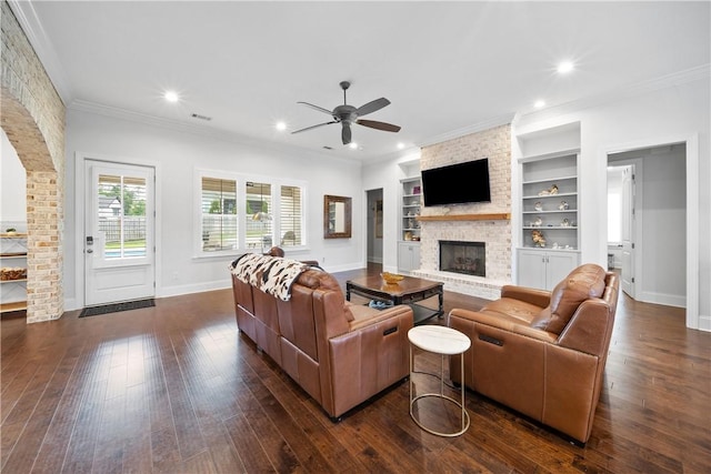 110 Newton Way, Auburn, AL 36830 - living area featuring ceiling fan, a brick fireplace, dark wood finished floors, built in features, and ornamental molding