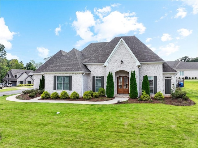 110 Newton Way, Auburn, AL 36830 - french country home featuring french doors, brick siding, a front lawn, and a shingled roof