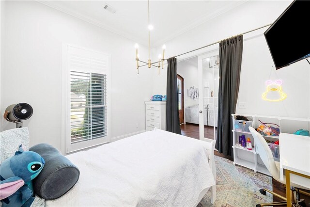 110 Newton Way, Auburn, AL 36830 - bedroom featuring ornamental molding, a chandelier, and wood finished floors