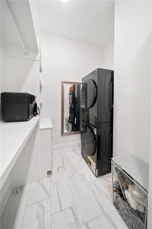110 Newton Way, Auburn, AL 36830 - laundry area featuring stacked washer / drying machine and light marble finish floors