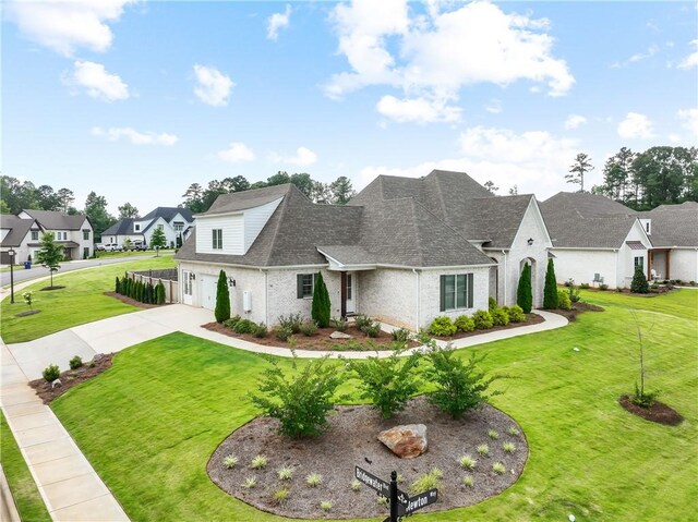110 Newton Way, Auburn, AL 36830 - view of front of home featuring an attached garage, concrete driveway, a shingled roof, and a front yard