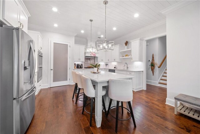 110 Newton Way, Auburn, AL 36830 - dining room featuring a chandelier, recessed lighting, dark wood finished floors, ornamental molding, and stairway