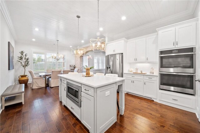 110 Newton Way, Auburn, AL 36830 - kitchen featuring stainless steel appliances, a chandelier, white cabinetry, light countertops, and a kitchen island