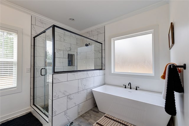 full bathroom featuring ornamental molding, a soaking tub, and a shower stall