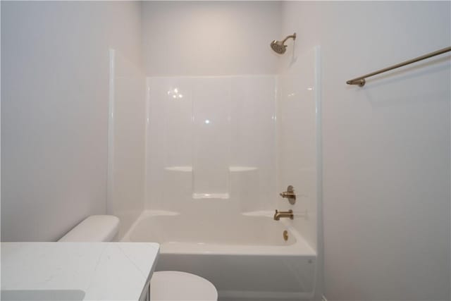 full bathroom featuring shower / bathing tub combination, vanity, and toilet