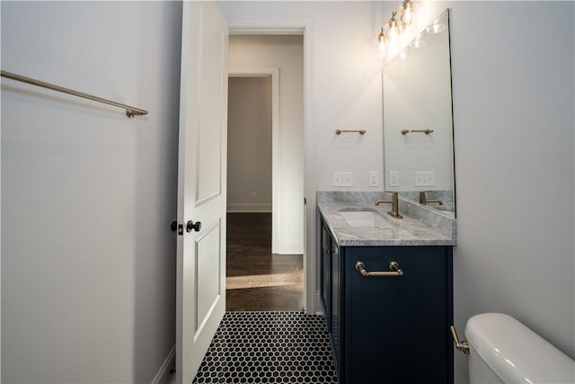 bathroom with vanity and toilet