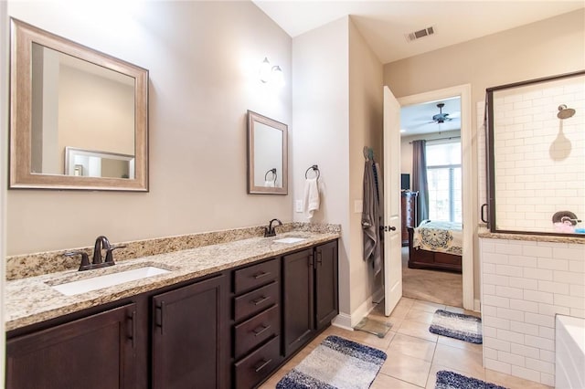 bathroom with tile patterned flooring, vanity, and ceiling fan