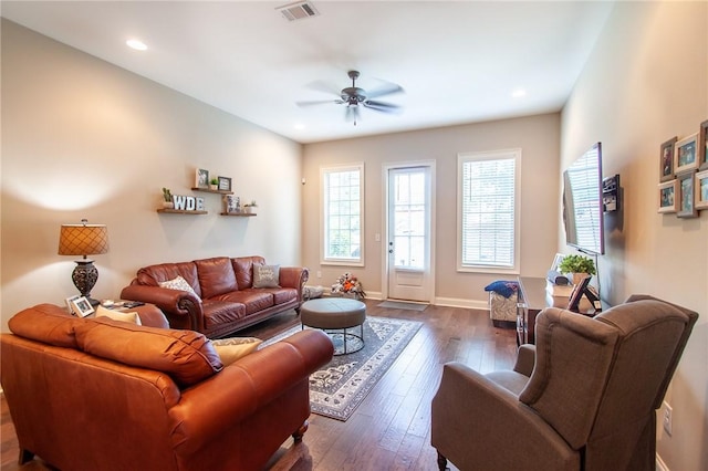 living room with ceiling fan and dark hardwood / wood-style floors