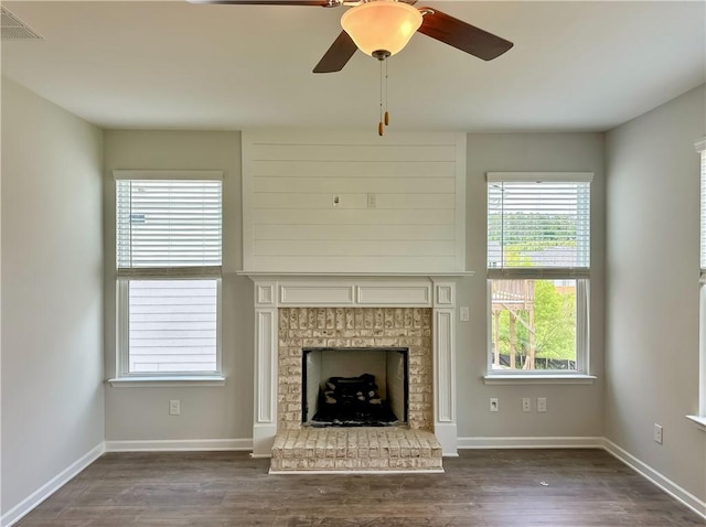 2260 Red Tail Ln, Auburn, AL 36879 - unfurnished living room featuring plenty of natural light, dark wood-style floors, a fireplace, and ceiling fan