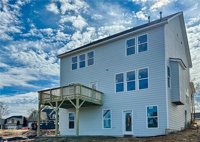 back of property featuring a deck