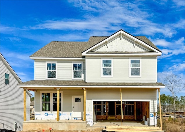 view of front facade featuring a garage and covered porch