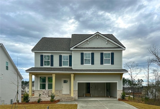 craftsman house with a porch, concrete driveway, a garage, and a shingled roof