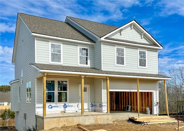 view of front of home featuring a garage and covered porch