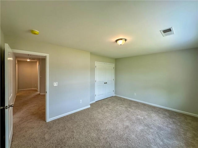2260 Red Tail Ln, Auburn, AL 36879 - unfurnished bedroom featuring carpet flooring, baseboards, and a closet