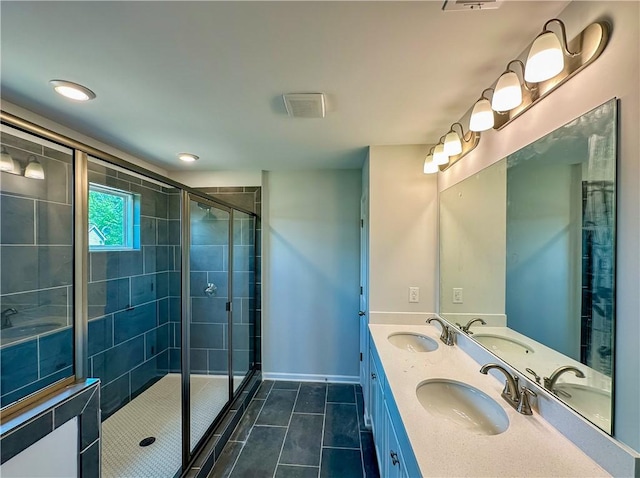 2260 Red Tail Ln, Auburn, AL 36879 - bathroom featuring tile patterned flooring, a shower stall, baseboards, and double vanity
