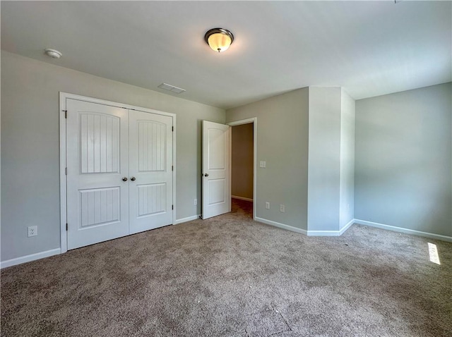 2260 Red Tail Ln, Auburn, AL 36879 - unfurnished bedroom featuring carpet, baseboards, and a closet