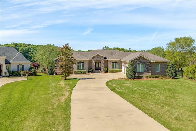 ranch-style home with a garage, brick siding, a front lawn, and concrete driveway