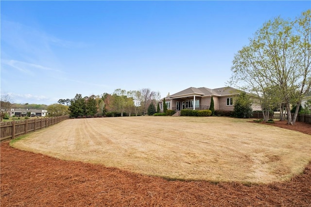 view of yard featuring fence
