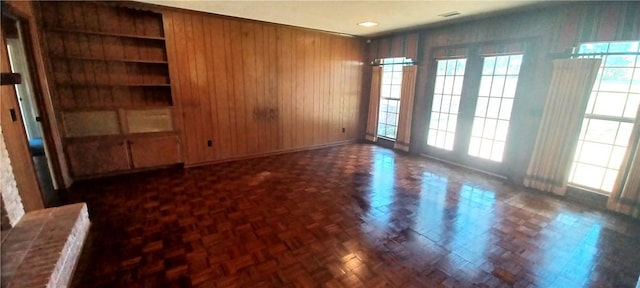 spare room with wooden walls