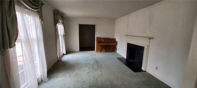 unfurnished living room with a fireplace with flush hearth