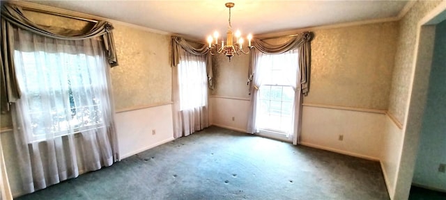 unfurnished dining area with carpet flooring, baseboards, an inviting chandelier, and ornamental molding