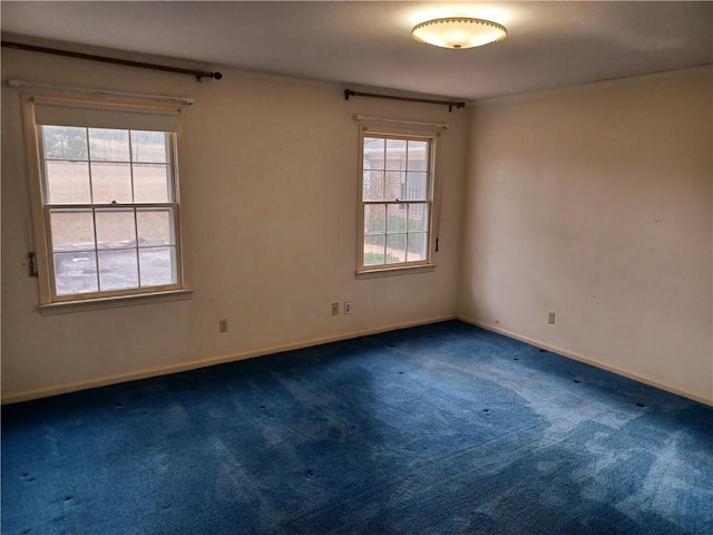 2104 Oak Bowery Rd, Opelika, AL 36801 - spare room featuring dark colored carpet and baseboards