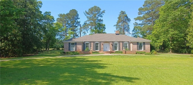 2104 Oak Bowery Rd, Opelika, AL 36801 - ranch-style house featuring a front lawn, a chimney, and brick siding