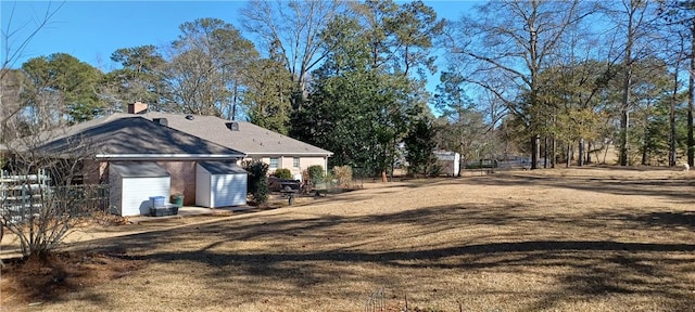 view of yard with a storage shed and an outdoor structure