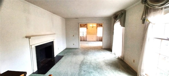 2104 Oak Bowery Rd, Opelika, AL 36801 - unfurnished living room featuring carpet and a fireplace with flush hearth