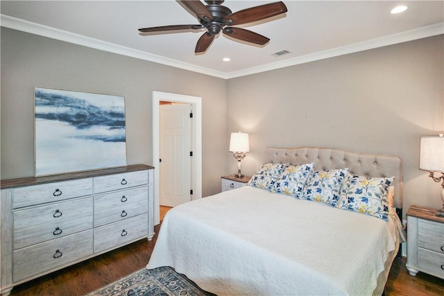 bedroom featuring dark hardwood / wood-style flooring, ceiling fan, and crown molding