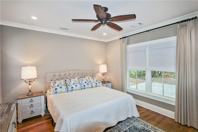 bedroom featuring crown molding, ceiling fan, and dark wood-type flooring