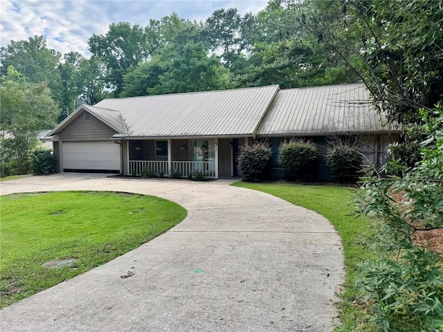 1377 E University Dr, Auburn, AL 36830 - ranch-style home with a front yard, curved driveway, covered porch, and an attached garage