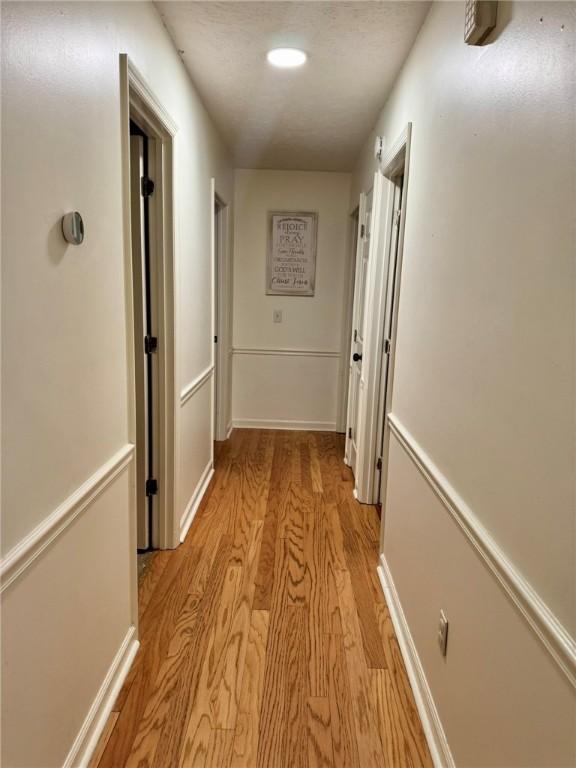 1377 E University Dr, Auburn, AL 36830 - hall with light wood-style flooring and recessed lighting