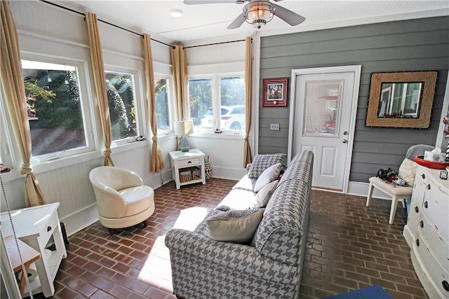 3403 Double Eagle Ln, Opelika, AL 36801 - sunroom featuring brick floors, baseboards, and wooden walls