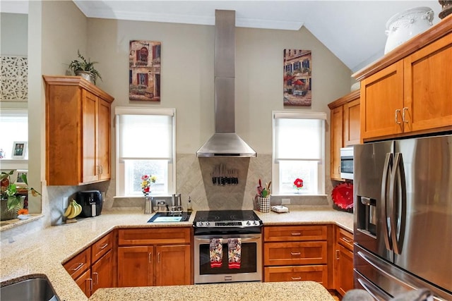 3403 Double Eagle Ln, Opelika, AL 36801 - kitchen featuring stainless steel appliances, wall chimney exhaust hood, backsplash, light stone counters, and brown cabinetry